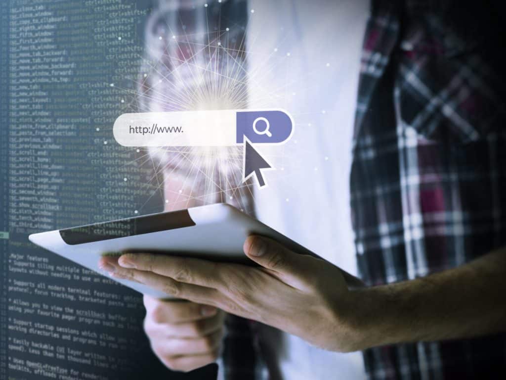 Professional working on web development at computer