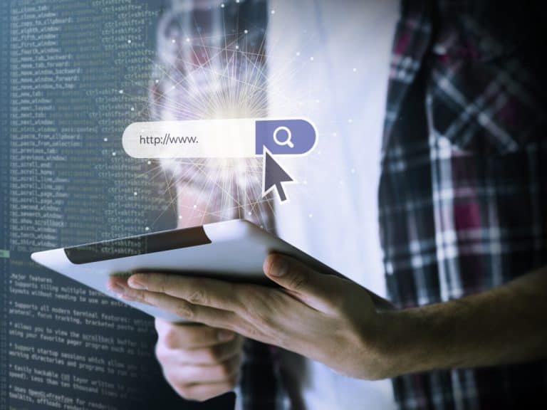 Professional working on web development at computer